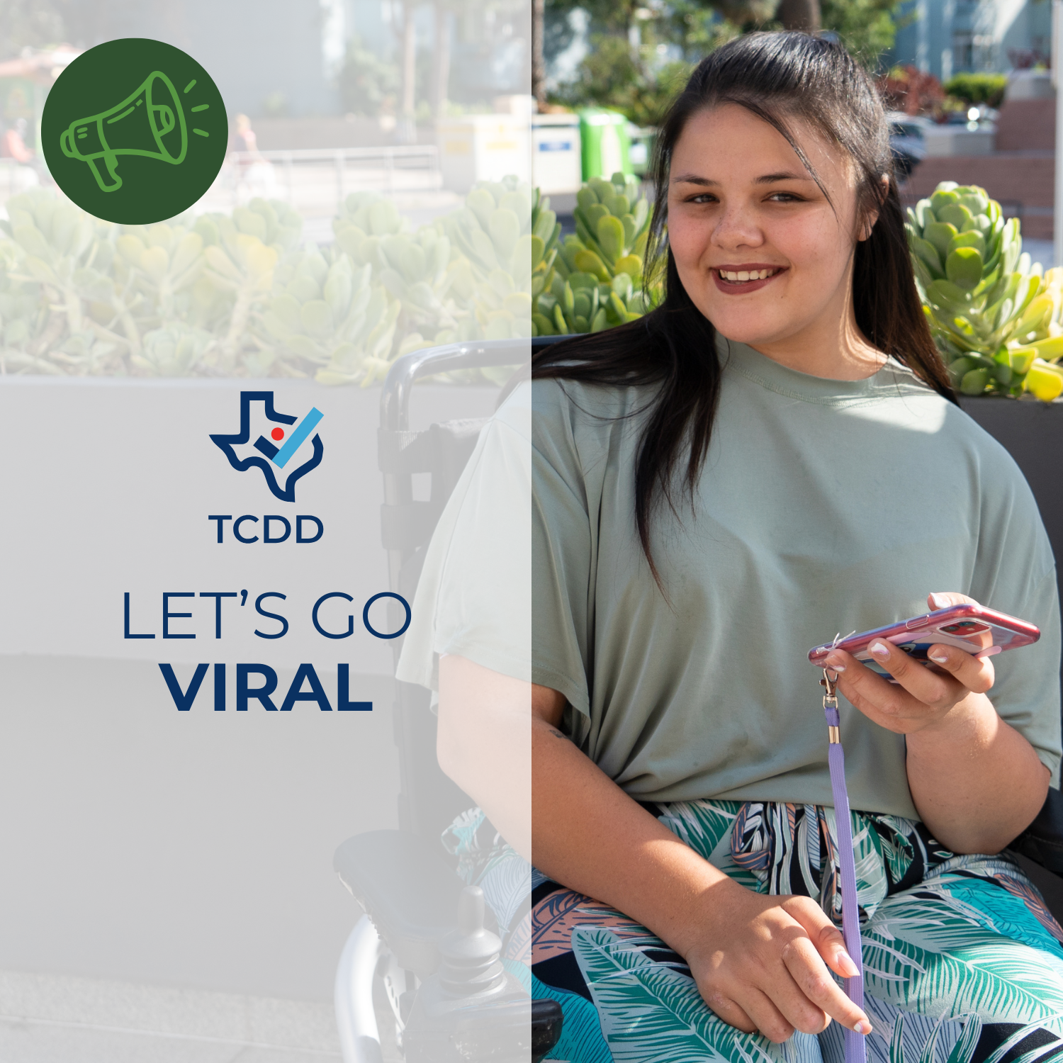 Let's go viral. A woman sitting in a wheelchair holds an iphone and smiles.